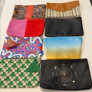 Lot of 8 assorted Ipsy cosmetic bags.